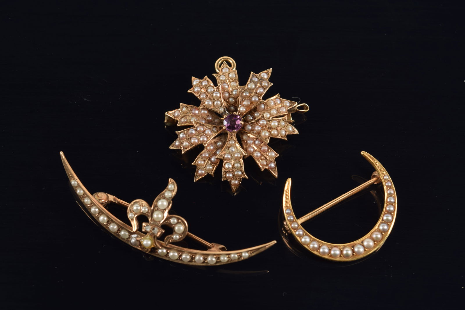 Lot of Edwardian gold and seed pearl mounted jewelry. To include: 1) 14K floral form pin-pendant (1 of 4)