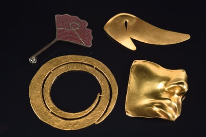 4 designer jewelry pieces. 1) John Iverson gold tone large swirl form bracelet. 4.5 diameter. 2)