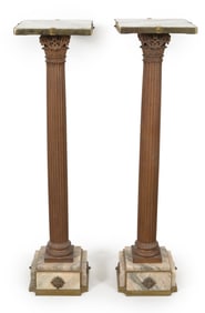 Pair of classical style plinths with marble tops and bases and patinated bronze Corinthian columns.