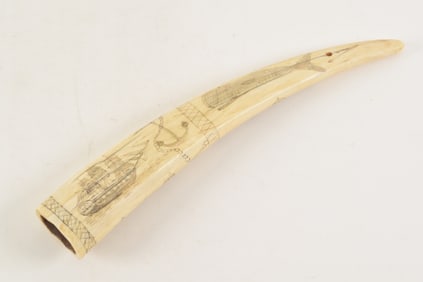 19th century scrimshaw decorated walrus tusk, one side with whale ship, anchor and whale, the other