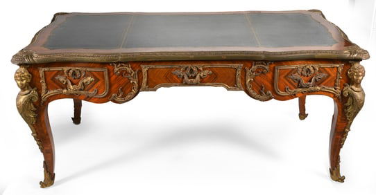 French walnut veneered and ormolu mounted bureau desk with leather top. Fitted with elaborate ormolu