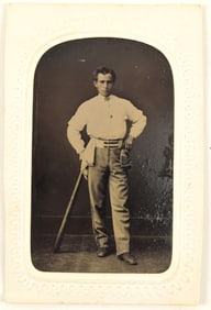 19th century tintype of a baseball player in uniform leaning with baseball bat and hat in hand.
