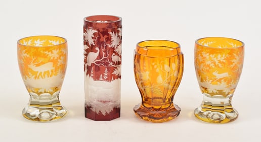 4 Bohemian Czech etched glass items, including a pair of amber footed tumblers with leaping stag