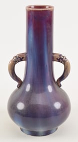 Large 18th century Chinese flambe glaze vase with beast form handles. Fine color variations. Fine
