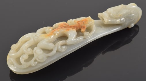 Large Chinese Ming period jade carved dragon belt buckle with russet markings. 6in long. 1.75in
