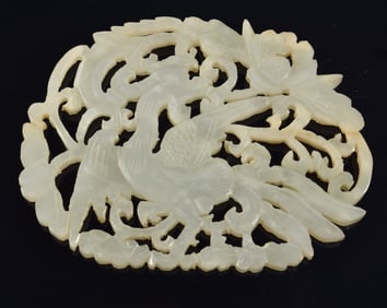 Early Chinese white jade oval form plaque with phoenix and floral pierced decoration. 2.75 x