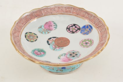 Antique Chinese small pedestal dish with famille rose decoration. 13 rondels on a white ground,