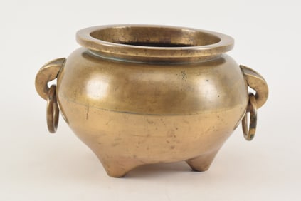 Antique bronze Chinese style tripod censer with ring handles. Unmarked. 7in high.