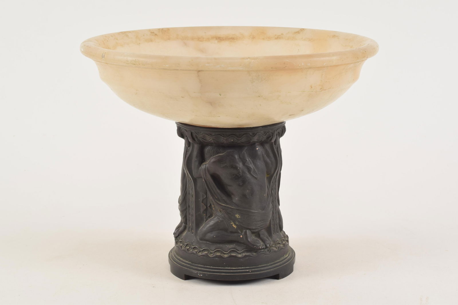 Antique bronze and alabaster pedestal dish. Bronze pedestal with depictions of Atlas supporting a: Antique bronze and alabaster pedestal dish. Bronze pedestal with depictions of Atlas supporting a carved alabaster dish. Dish as-is. 8.5in high.