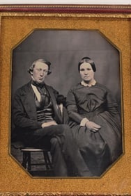 1/2 plate daguerreotype of a husband and wife, mid 19th century. Clean image of a seated couple.