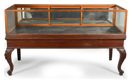 Edwardian oak display cabinet with rectangular case on a frame with cabriole legs and paw feet.