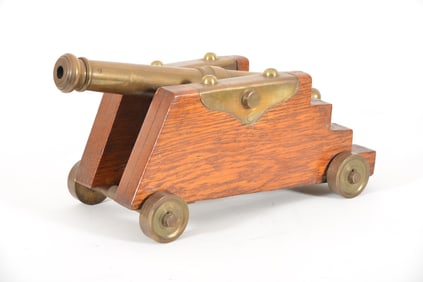 Late 19th/early 20th century bronze signal cannon. Original oak carriage with bronze mounts and