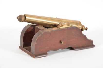 Late 19th century brass yacht signal cannon. Flat wooden carriage with brass mounts. Appears