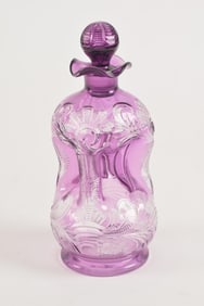 English purple cut to clear glass perfume bottle. Pinched form. 6in high.
