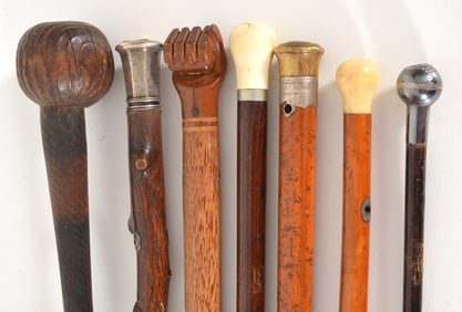 Lot of 7 antique walking sticks. To include: 1) 1703 dated stick with inscribed silver band: "John