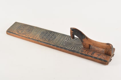 Scandinavian carved and painted clothes press with horse form handle and chip carving, dated 1784.