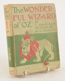 L. Frank Baum. The Wonderful Wizard of Oz. First edition, second state. Binding shaken and worn,