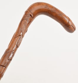 Folk art carved wood "story" cane, first half 20th century. Pig head handle, monogrammed, various