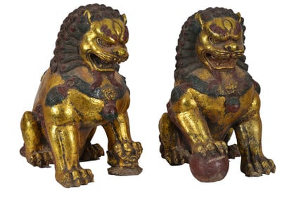 Pair of 20th century Chinese cast iron gilt and polychrome decorated foo dogs sculptures. 18.5in