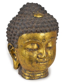 20th century gilt cast iron buddha head. 15in high.