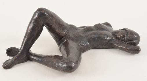 Signed bronze sculpture of a reclining nude woman. Monogrammed on foot "MS" along with other mark.
