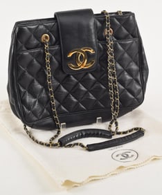 Large Chanel black leather quilted pattern purse with dust bag.