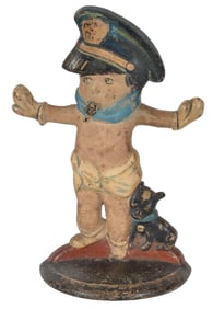 Antique cast iron police boy doorstop. 10.5in high.