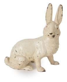 Antique cast iron unusual stance rabbit doorstop. 9in high.