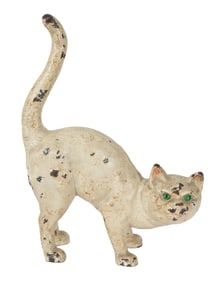 Antique cast iron crouching cat doorstop. 10.75in high.