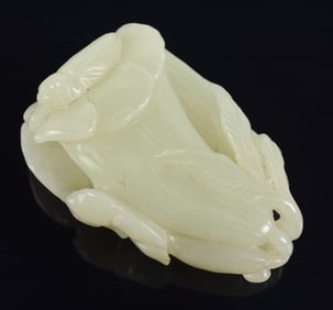 Jade pendant. China. 18th/19th century. Lychee white stone carved as magnolia flowers. 1.75in
