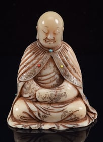 Carved soapstone figure of Luo Han. China. 20th century. 3in high.