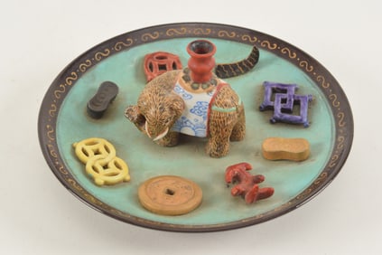 Incense stick holder. China. 19th century. Saucer shaped with an elephant, valuable objects and