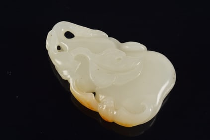 Jade pendant. China. 18th century. Pure white, highly translucent stone. Carved as a gourd with
