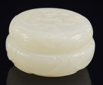 Jade seal paste box. China. 18th century. Pure white stone, highly translucent. Surface carved with