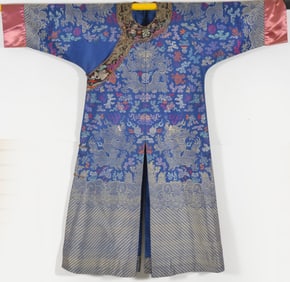 Dragon robe. China. Early 20th century. Brocade multi color with auspicious emblems.