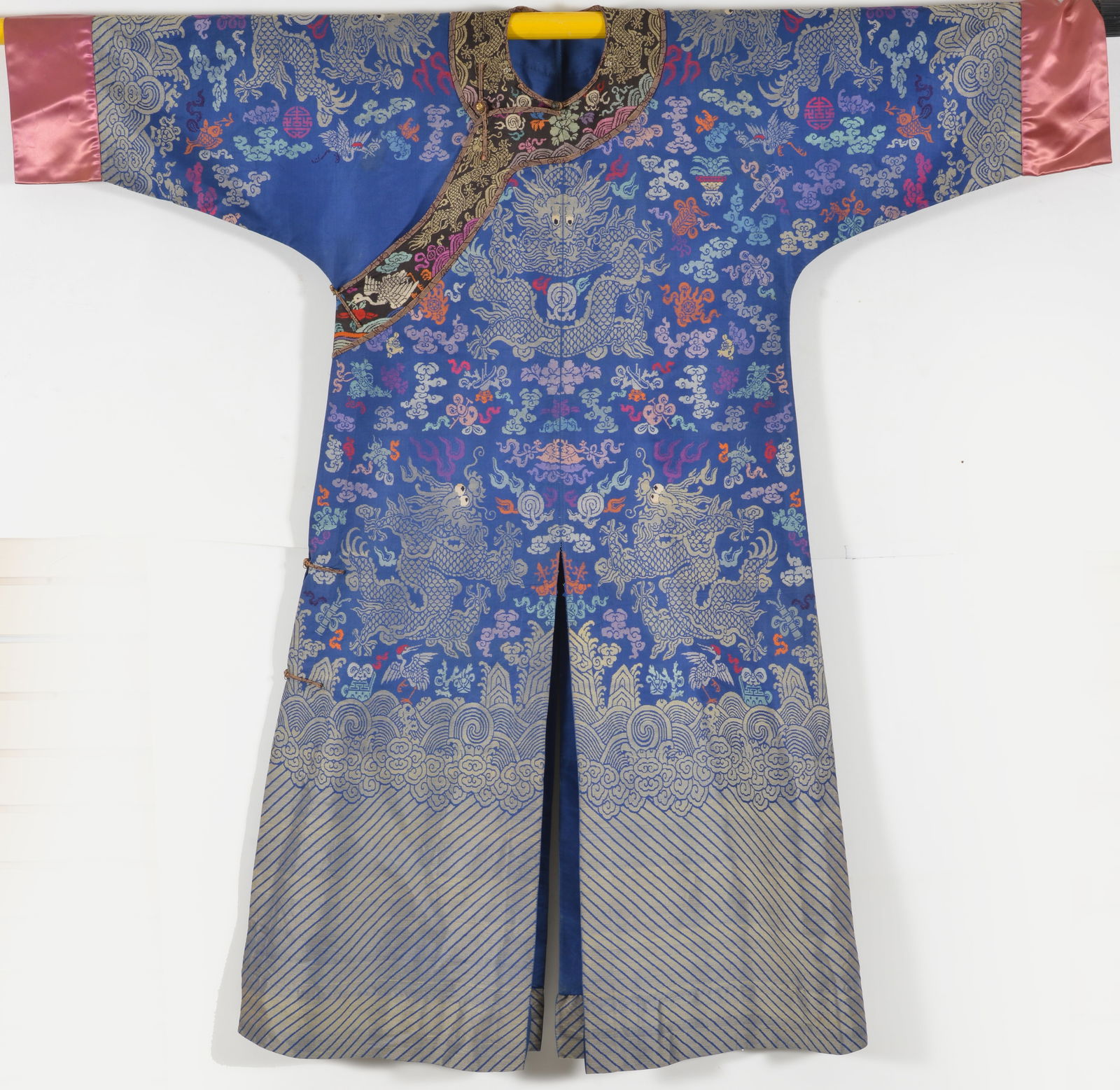Dragon robe. China. Early 20th century. Brocade multi color with auspicious emblems. (1 of 6)