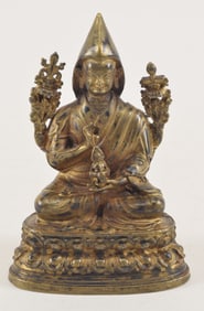 Gilt bronze buddhist image. Tibet. 19th century. Seated figure of a lama. 4in.