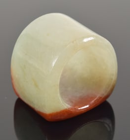 Jade archers ring with a pronounced "tomato skin" patch.