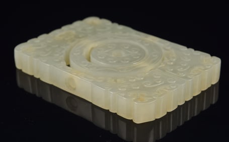 Jade pendant. China. 18th century. Pale celadon color. Rectangular shape with moveable center.
