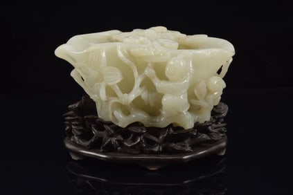 Jade coupe. China. 18th century. White stone carved with children, ling chih and bats. 4.75x 2in.