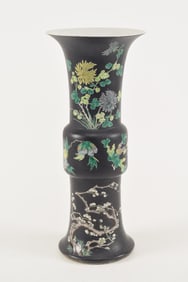 Famille noir beaker vase. China. Early 20th century. 17in high. Drilled.