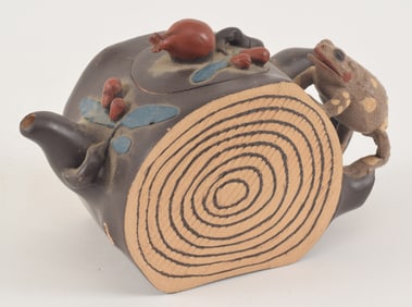 Yi Hsing tea pot. China. 20th century. Carved as a pomegranate trunk section with a frog. 6in