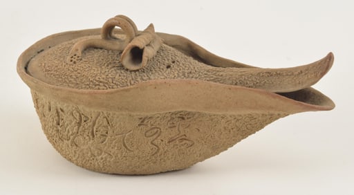Yi Hsing tea pot. China. Early 20th century. Shaped as a lotus leaf. 4.5in length.