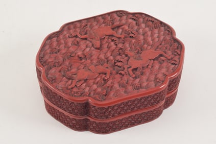 Cinnabar box. China. Chien Lung period (1735-1796). Lobated form. surface carved with celestial