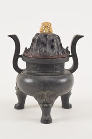 Bronze Ting form censer. China. Ming period (1368-1644). Carved fitted lotus form cover. 9.5 x