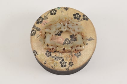 Jade belt ornament. China. Yuan period (1279-1368). Carving of dragons and clouds. Mounted on a silk
