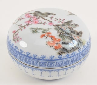 Porcelain seal paste box. China. 20th century. Famille rose decoration of birds in a flowering tree.