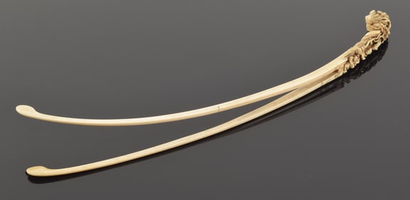 Women's hair pin. China. 18th century or earlier. Finial carved with a buddhist scene. 14in length.