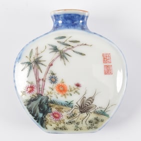 Porcelain snuff bottle. China. 18th century. Underglaze Chien Lung mark and borders with scenes of