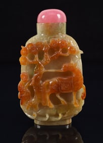 Jade snuff bottle. China. Early 20th century. Surface carved with a horse and groom. Pink tourmaline